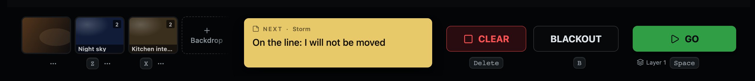 The next cue's note, between the backdrops and the transport. It is yellow because it is a person talking, not the console reporting.